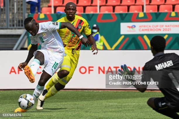 Senegal's forward Sadio Mane shoots and fails to score as Zimbabwe's goalkeeper Petros Mhari prepares to make a save during the Group B Africa Cup of...