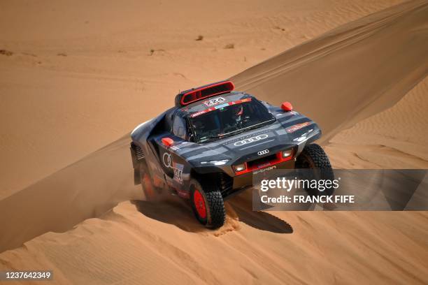 Swedish driver Mattias Ekstrom and his co-driver Emil Bergkvist of Sweeden compete in their Audi electric during the Stage 8 of the Dakar Rally 2022...
