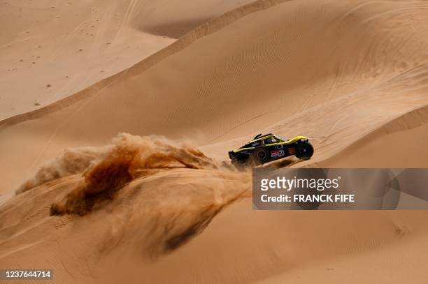 French driver Christian Lavieille and co-driver Johnny Aubert of France compete during the Stage 8 of the Dakar Rally 2022 between al-Dawadimi and...