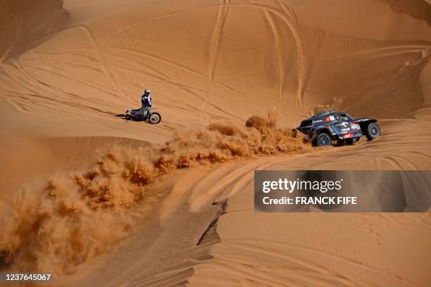 Mini's driver Jakub Przygonski of Poland and his co-driver Timo Gottschalk of Germany compete during the Stage 8 of the Dakar Rally 2022 between...