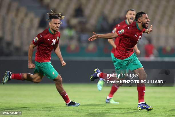 Morocco's forward Sofiane Boufal celebrates after scoring a goal during the Africa Cup of Nations 2021 football match between Morrocco and Ghana at...