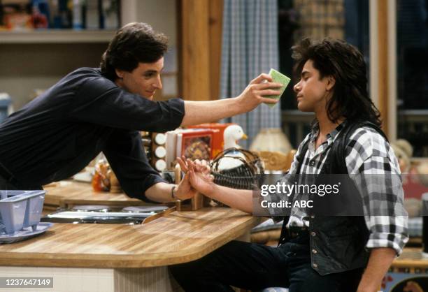 Los Angeles, CA Bob Saget, John Stamos appearing in the ABC tv series 'Full House', episode 'Mad Money'.