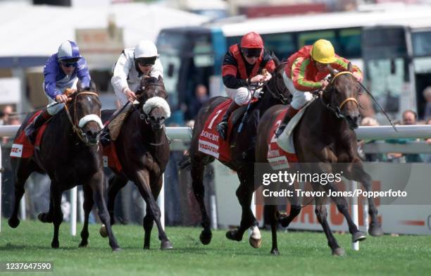 South African jockey Michael Roberts riding Mr Martini winning the Diomed Stakes at Epsom, 9th June 1995. Placed second jockey David Harrison riding...