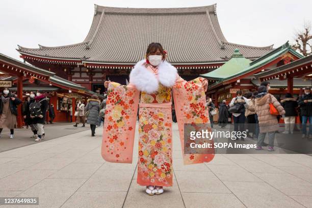 Young woman in traditional kimono visits Senso-ji temple to celebrate Seijin no Hi . Japanese people who have their 20th birthday in this year...