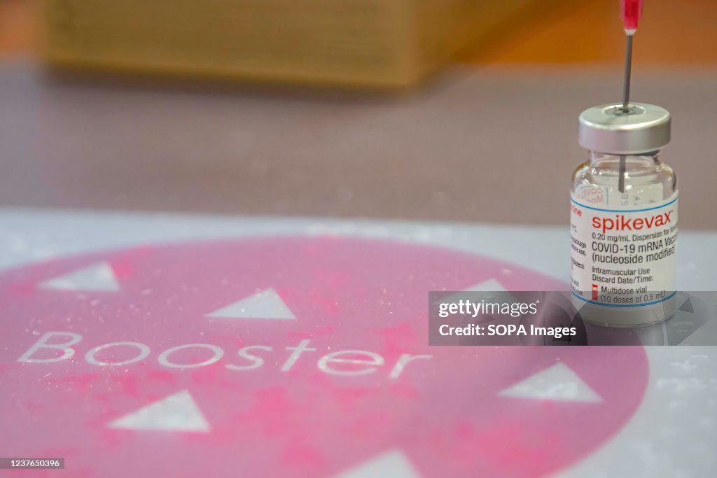 A vial containing Moderna Covid-19 booster vaccine at a...