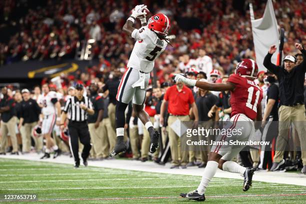 Kelee Ringo of the Georgia Bulldogs intercepts the ball in the fourth quarter of the College Football Playoff Championship game against the Alabama...