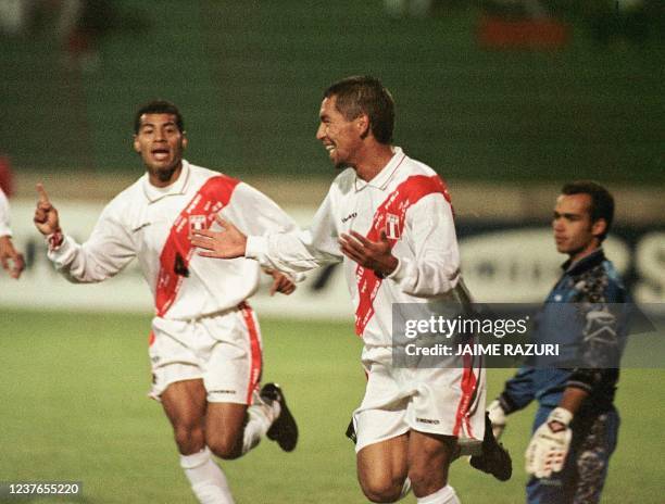 Peru's Paul Cominges celebrates his first goal against Venezuela 18 June in Sucre, Bolivia, during their Copa America match. Cominges scored the two...