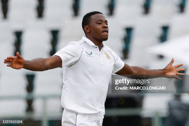 South Africa's Kagiso Rabada celebrates after the dismissal of India's Mayank Agarwal during the first day of the third Test cricket match between...