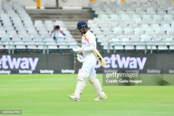 Cheteshwar Pujara of India walks off after being dismissed during day 1 of the 3rd Betway WTC Test match between South Africa and India at Six Gun...