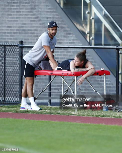 Brianna Davey of the Magpies, who suffered an ACL injury on the weekend, is seen receiving a massage during the Collingwood training session at the...