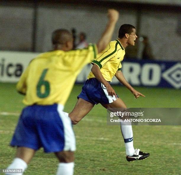 Brazil's Rivaldo celebrates scoring the first goal against Argentina during their Copa America quarter final match. Teammate Roberto Carlos joins in...