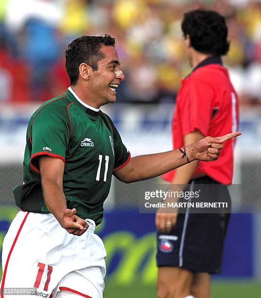 Mexico's Daniel Osorno celebrates after scoring the second goal 22 July against Chile in the quarter-finals Copa America match in Pereira, Colombia....