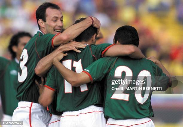 Heriberto Morales and Ramon Morales of Mexico celebrate teammate Daniel Osorno's goal against Costa Rica during their Copa America tournament...