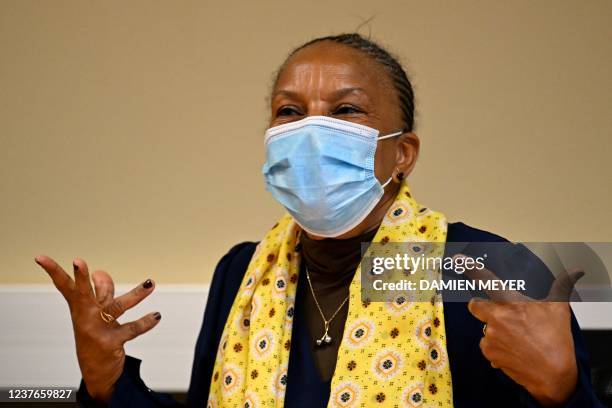 Former French Justice Minister Christiane Taubira, wearing a protective face mask, gestures during a meeting with Apase association leaders in...