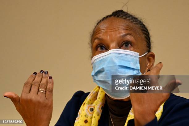 Former French Justice Minister Christiane Taubira, wearing a protective face mask, gestures during a meeting with Apase association leaders in...