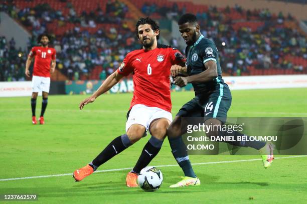 Egypt's defender Ahmed Hegazi fights for the ball with Nigeria's forward Kelechi Iheanacho during the Group D Africa Cup of Nations 2021 football...