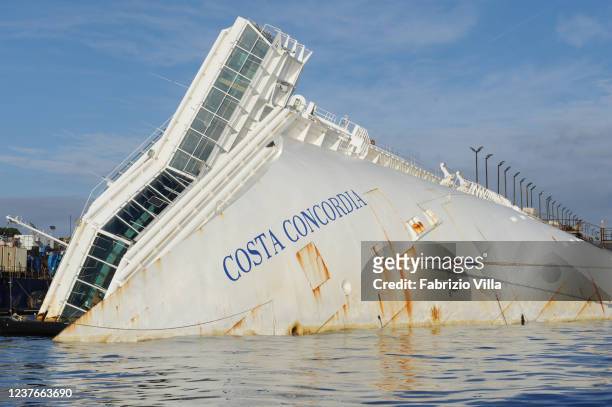 Detail of the Costa Concordia ship, almost a year after the disaster, with technicians during the operations to straighten the wreckage on January...