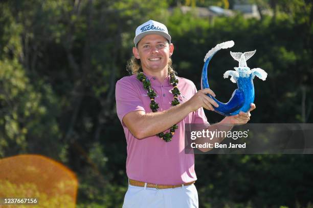 Cameron Smith of Australia holds the trophy on the 18th green after the final round of the Sentry Tournament of Champions on the Plantation Course at...