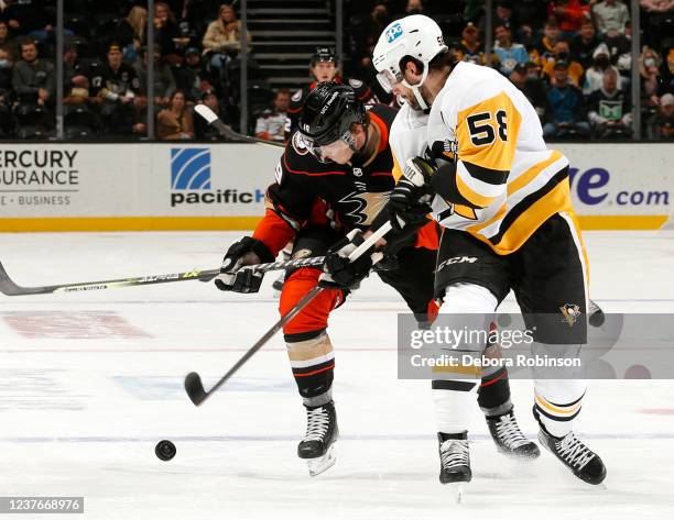 Troy Terry of the Anaheim Ducks and Kris Letang of the Pittsburgh Penguins battle for position during the first period at Honda Center on January 11,...