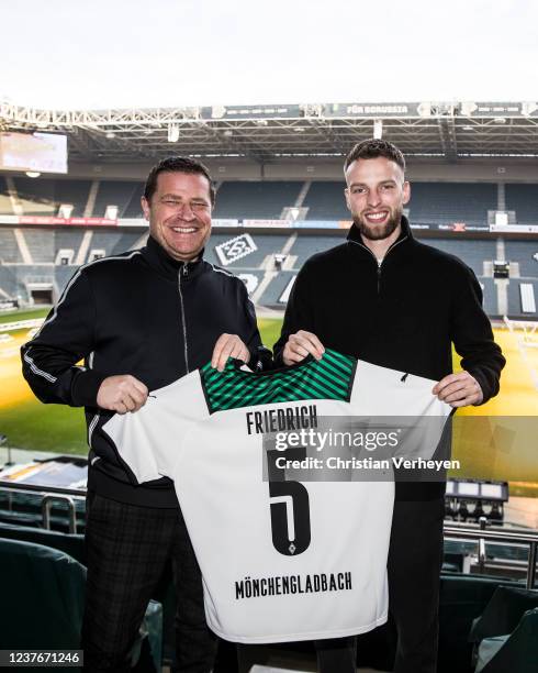 Director of Sport Max Eberl of Borussia Moenchengladbach and Marvin Friedrich pose after Marvin signs a contract for Borussia Moenchengladbach at...