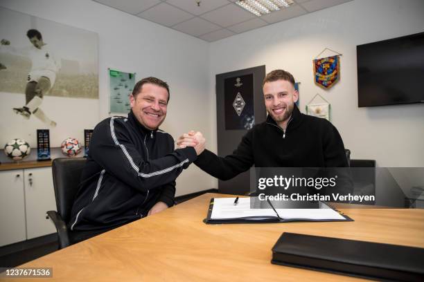 Director of Sport Max Eberl of Borussia Moenchengladbach and Marvin Friedrich are seen after he signs a contract for Borussia Moenchengladbach at...