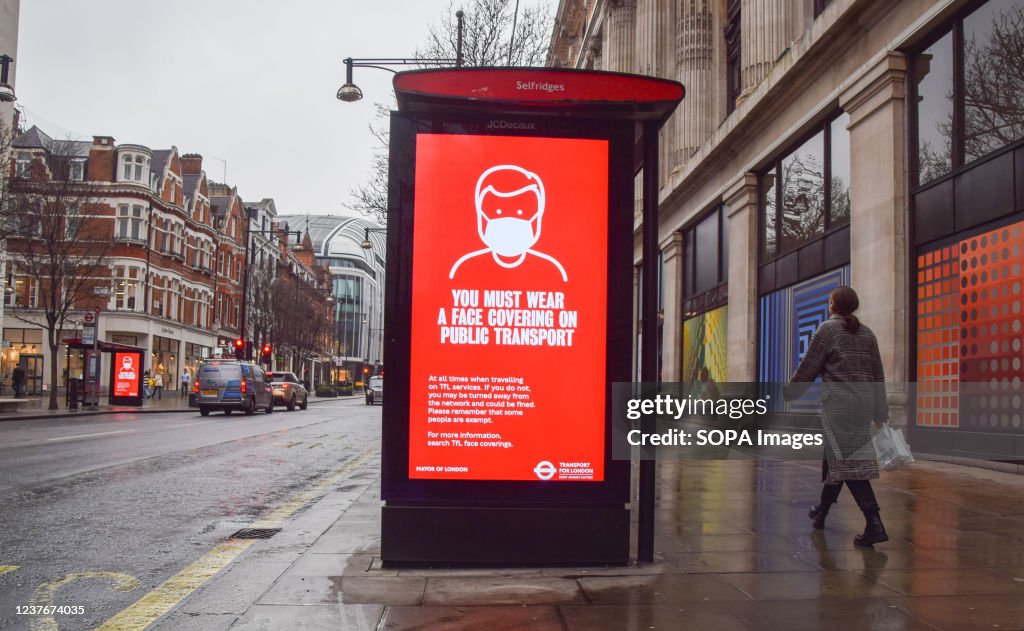 A display is seen on a bus stop on Oxford Street that...