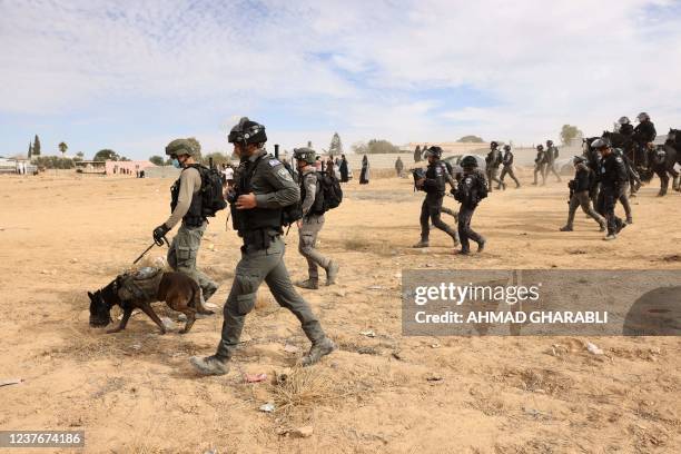 Israeli police forces are deployed as Bedouins protest in the southern Israeli village of Sawe al-Atrash in the Neguev Desert against an...