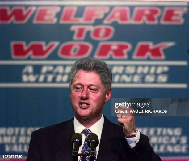 President Bill Clinton clinches his fist during a 27 October speech on welfare reform at Vanderbilt University Medical Center in Nashville,...