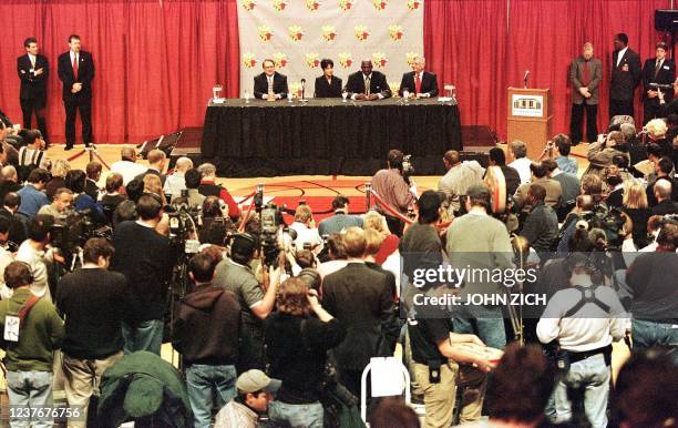 Michael Jordan of the Chicago Bulls sits with his wife Juanita Jerry Reinsdorf , chairman of the Bulls and NBA commissioner David Stern at a press...