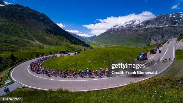 The peloton at Tour de Suisse 2021, cyclists racing up to the Oberalp Pass at 2044 m.