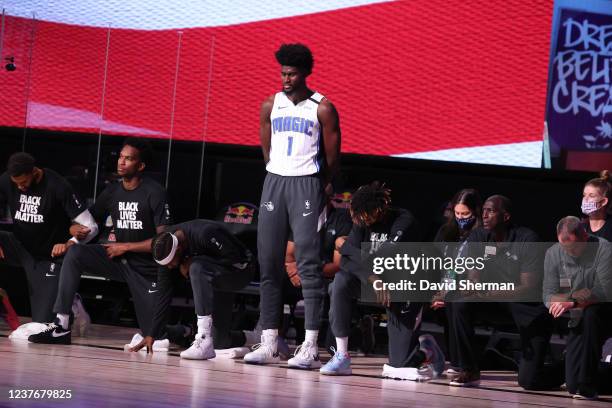 Jonathan Isaac of the Orlando Magic stands for the National Anthem prior to the game against the Brooklyn Nets during a scrimmage on July 31, 2020 at...