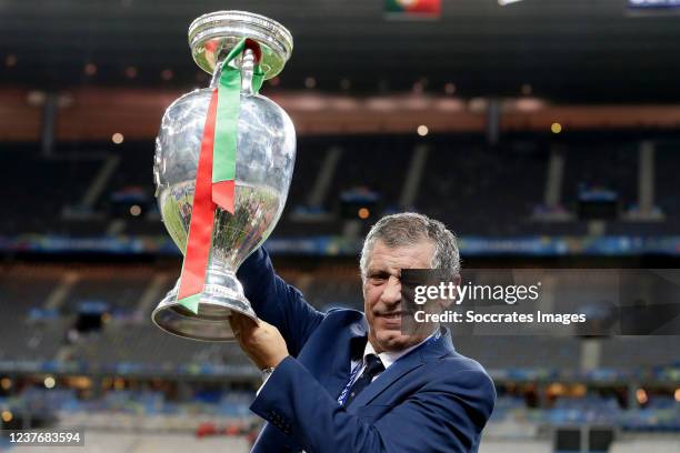 Coach Fernando Santos of Portugal celebrates with the trophy during the EURO match between France v Portugal at the Stade de France on July 10, 2016...