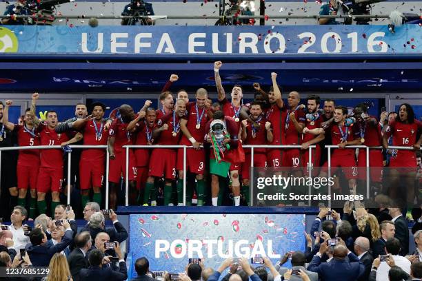 Team of portugal celebrates lifting the trophy Raphael Guerreiro of Portugal Anthony Lopes of Portugal Danilo of Portugal Ricardo Quaresma of...