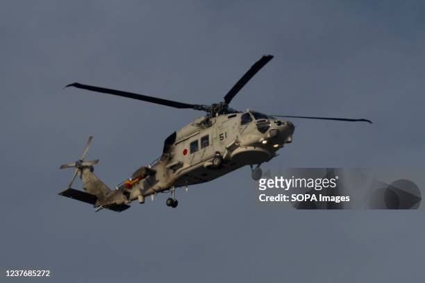 Sikorsky SH-60K Seahawk helicopter with the Air development Squadron 51 of the Japanese Self Defence Force flying above Kanagawa, Japan.