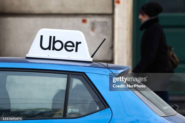 Uber sign is seen on a car in Krakow, Poland on January 12, 2022.