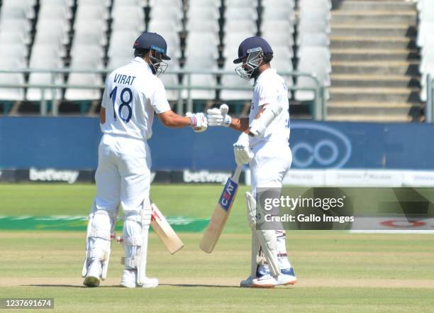 Virat Kohli and Ajinkya Rahane of India touch gloves during day 3 of the 3rd Betway WTC Test match between South Africa and India at Six Gun Grill...