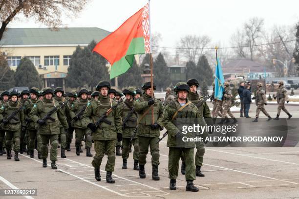 Collective Security Treaty Organisation's Belarus' soldiers attend a ceremony marking the end of the CSTO mission in Almaty, on January 13, 2022. -...