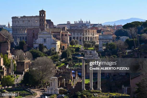 General view taken from Capitoline Hill shows the ancient Roman Forum and the Colosseum monument on January 13, 2022 in Rome.