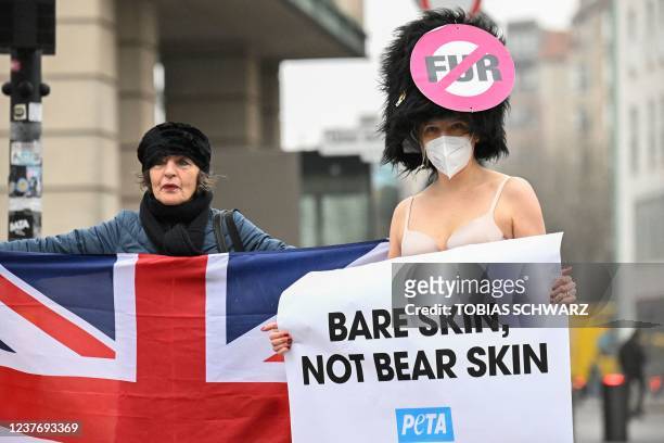 Activists of the animal rights group PETA stages a protest calling for the replacement of the Queen's Guard bearskin hats with hats made of...