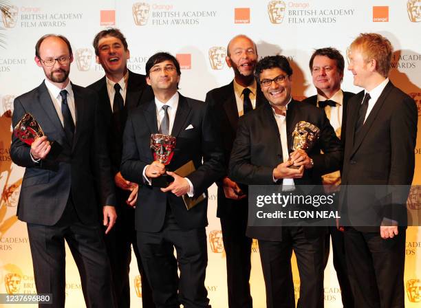 British director Asif Kapadia poses with the award for best documentary for "Senna" with Film writer and producer Manish Pandey, film editor Gregers...