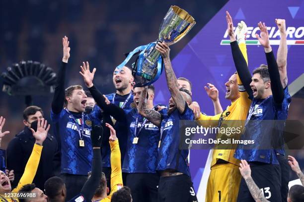 Arturo Vidal of FC Internazionale lifts the Supercoppa Italiana trophy into the air after the italian SuperCup match between FC Internazionale and...