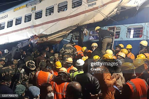 Disaster management and rescue teams work at the site of a train accident near Moynaguri railway station in the eastern Indian state of West Bengal...