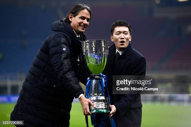 Simone Inzaghi , head coach of FC Internazionale, and Steven Zhang, president of FC Internazionale, hold the trophy at the end of the Supercoppa...
