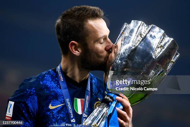 Stefan de Vrij of FC Internazionale kisses the trophy during the awards ceremony at end of the Supercoppa Frecciarossa football match between FC...