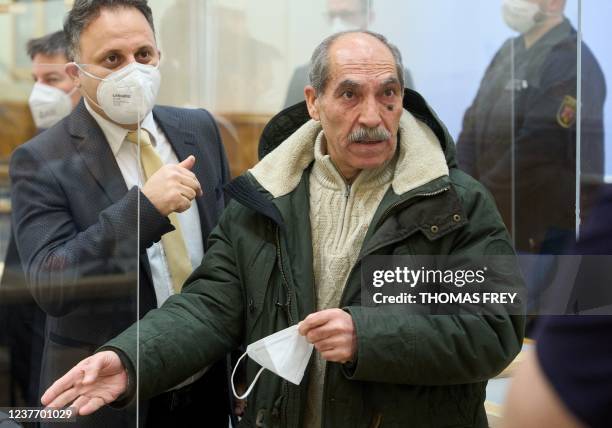 The defendant, former Syrian intelligence officer Anwar Raslan , gestures next to one of his lawyers in the courtroom at a courthouse in Koblenz,...