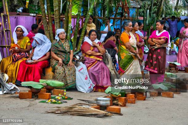 Hindu women wait for the signal to begin cooking pongala along during the Attukal Pongala Mahotsavam Festival in the city of Thiruvananthapuram ,...