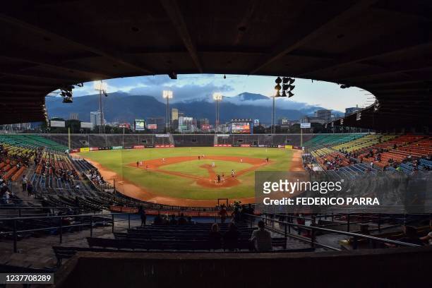 Fans watch the round robin game of the Venezuelan Baseball League between Cardenales de Lara and Leones del Caracas, at the Universitario stadium in...