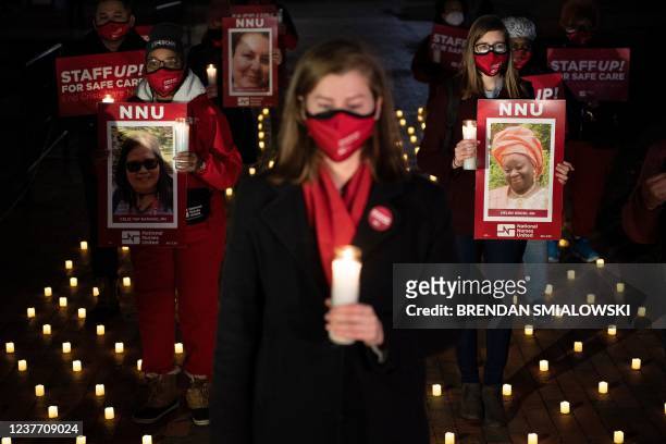 Activists gather during a vigil in Lafayette Park for nurses who died during the COVID-19 pandemic on January 13 in Washington, DC.