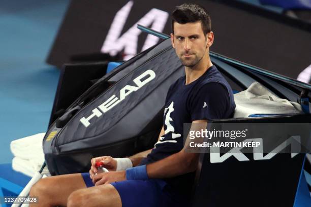 Novak Djokovic of Serbia attends a practice session ahead of the Australian Open tennis tournament in Melbourne on January 14, 2022. - --IMAGE...