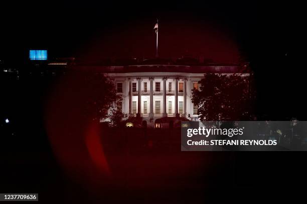 The White House is seen at night in Washington, DC on January 13, 2022.